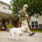 Female resident taking her dog for a walk