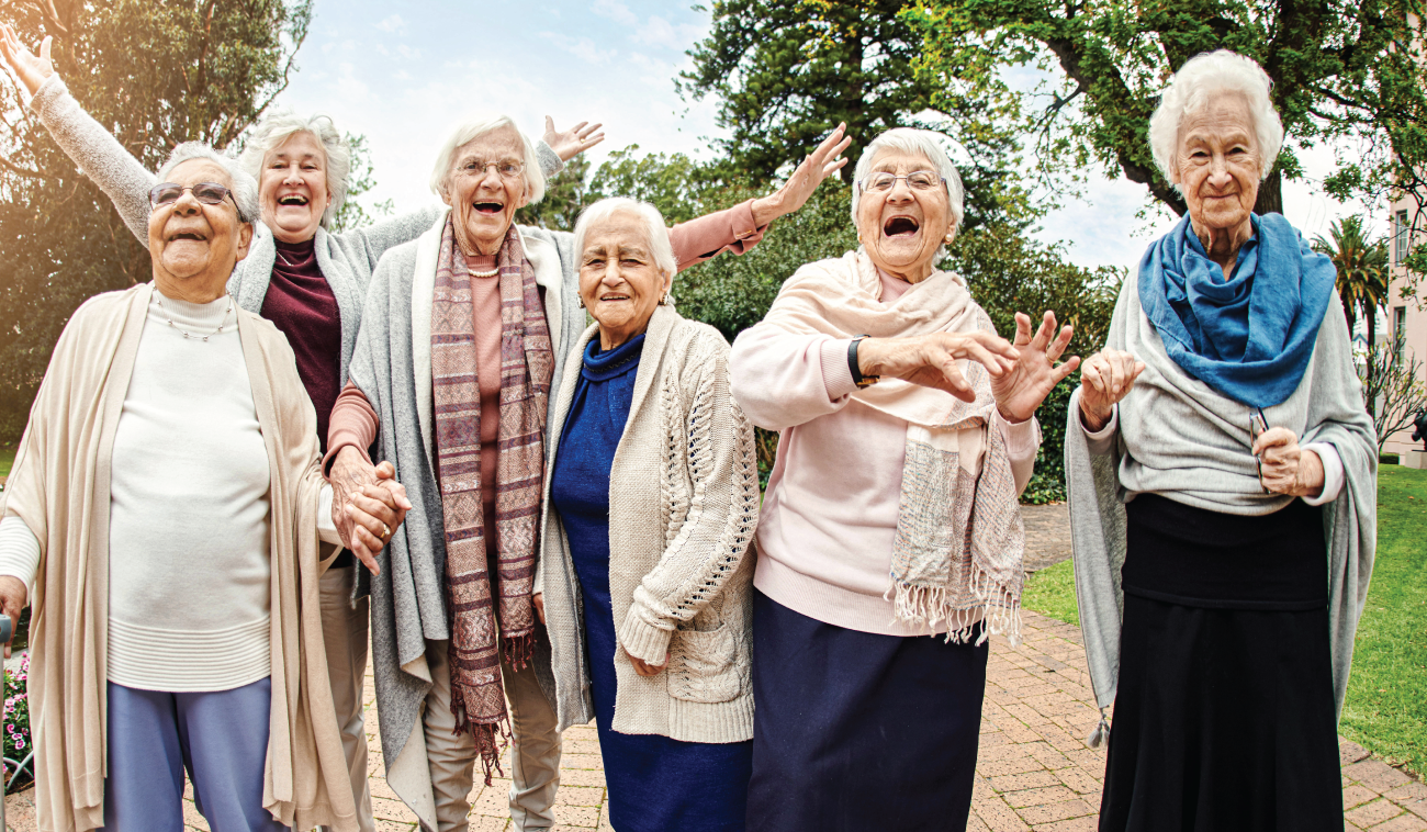 Group of cheering seniors outside