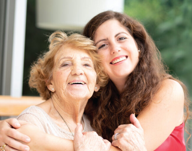 5644_CYS_ShareTheLove_HalfPg_Ad_Waukesha A younger woman giving an older woman a big hug