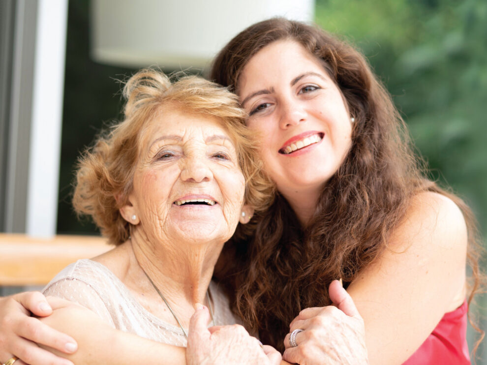 5644_CYS_ShareTheLove_HalfPg_Ad_Waukesha A younger woman giving an older woman a big hug